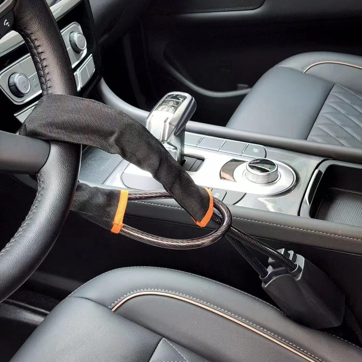Vodreach lock fitted through a steering wheel and into the seat belt buckle